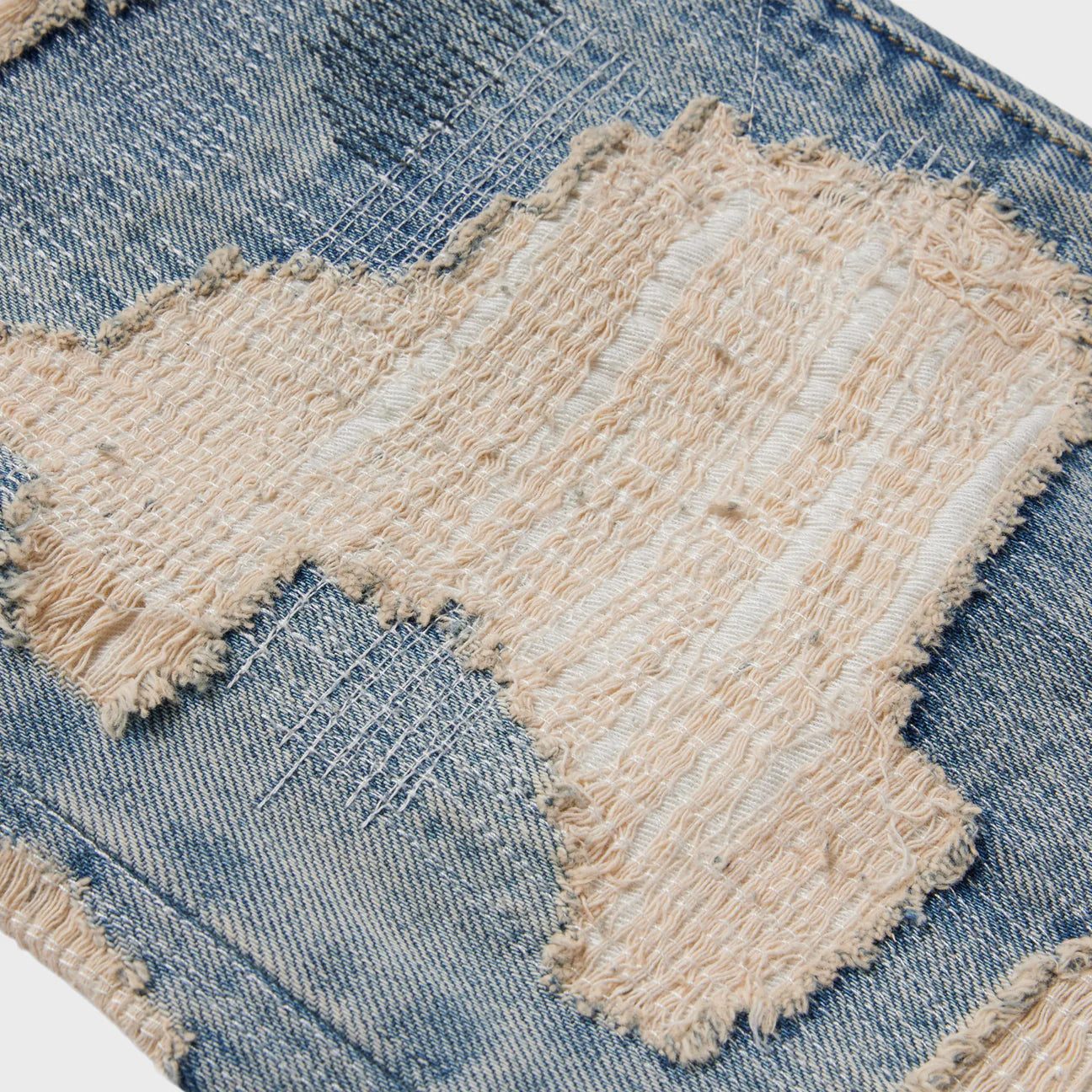 OVER DISTRESSED DENIM